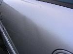 The two dents in the driver rear door.