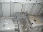 metal work on rear of inside of cab